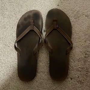 Brown rainbow flip flops
